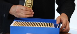 Gold falls on dollar strength, market awaits US inflation data