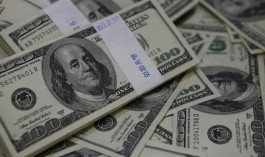 الدولار يهبط لأدنى مستوى أمام اليوان في أكثر من عامين